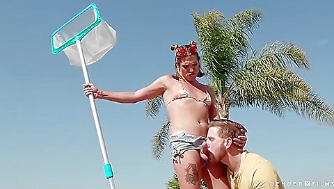 Busty blonde with a tattooed pussy is playing in the pool